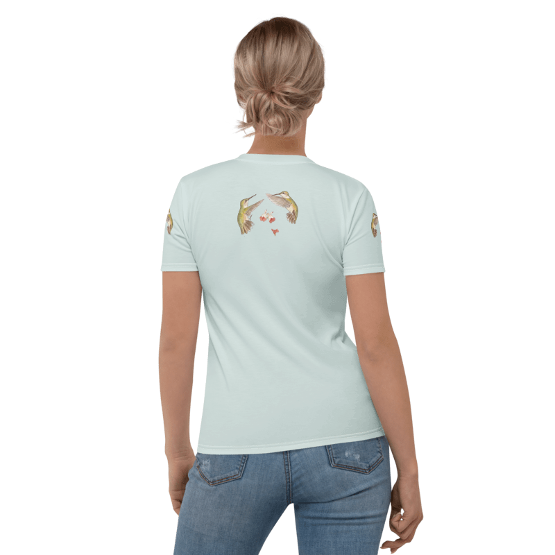 Backview of Woman wearing a light blue t-shirt with a graphic of hummingbirds and text "Nature's Little Pollinators"