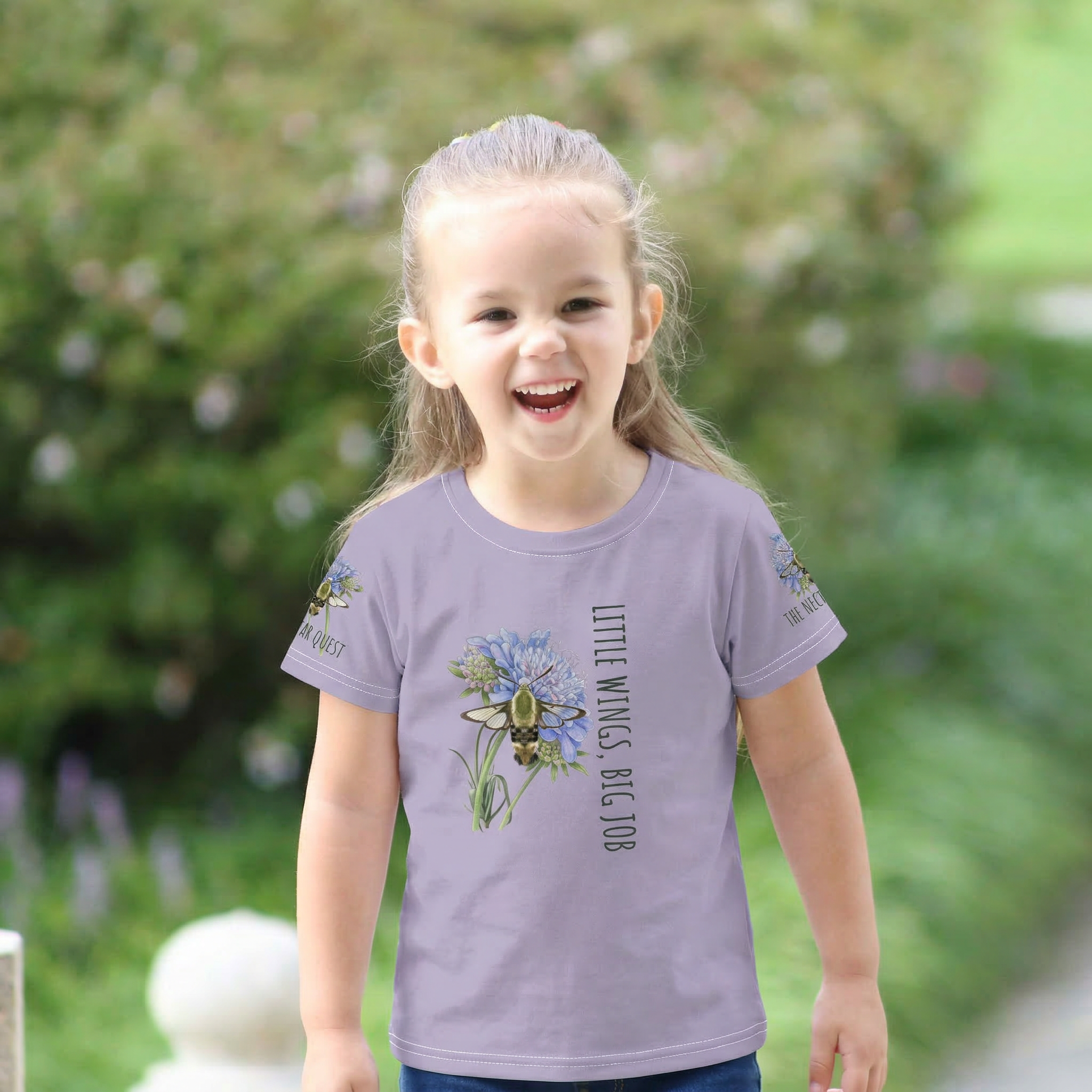 "Vibrant all-over print toddler t-shirt featuring hand-painted hummingbirds and wildflowers from Tinywing Tales."