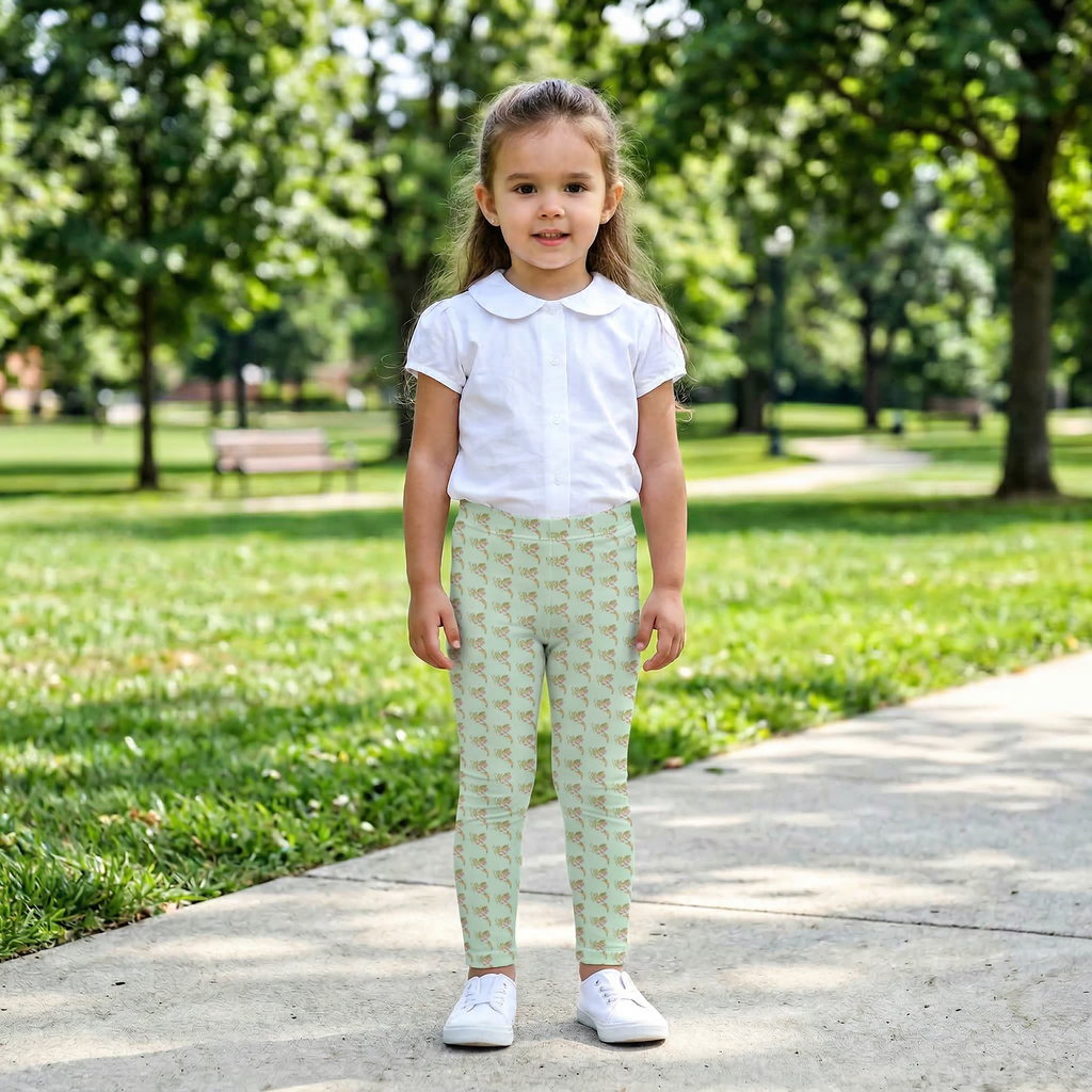 Close up of a child walking outdoors wearing Tinywing Tales "Tiny wings, Big Job,"  hummingbird print leggings.