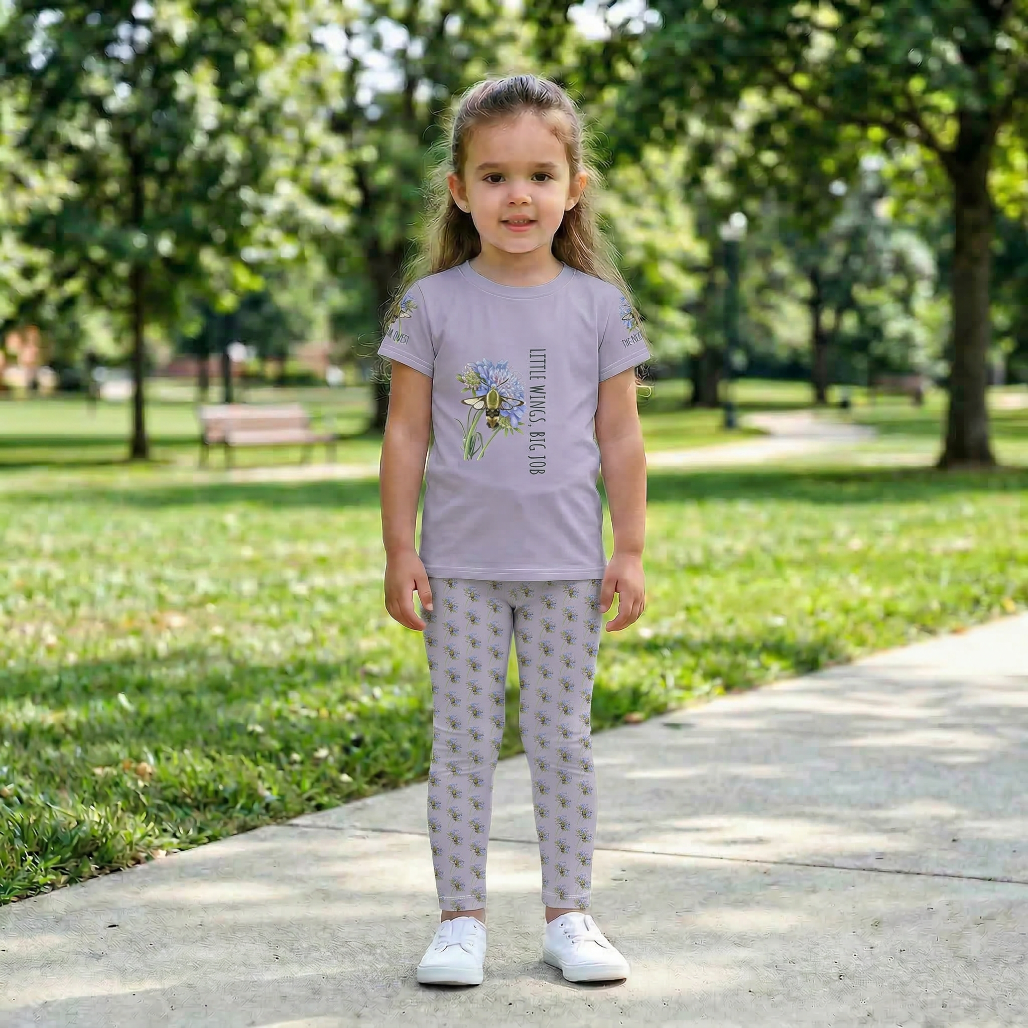Close up of a child walking outdoors wearing Tinywing Tales hummingbird print leggings made of smooth, stretchy fabric for active play.