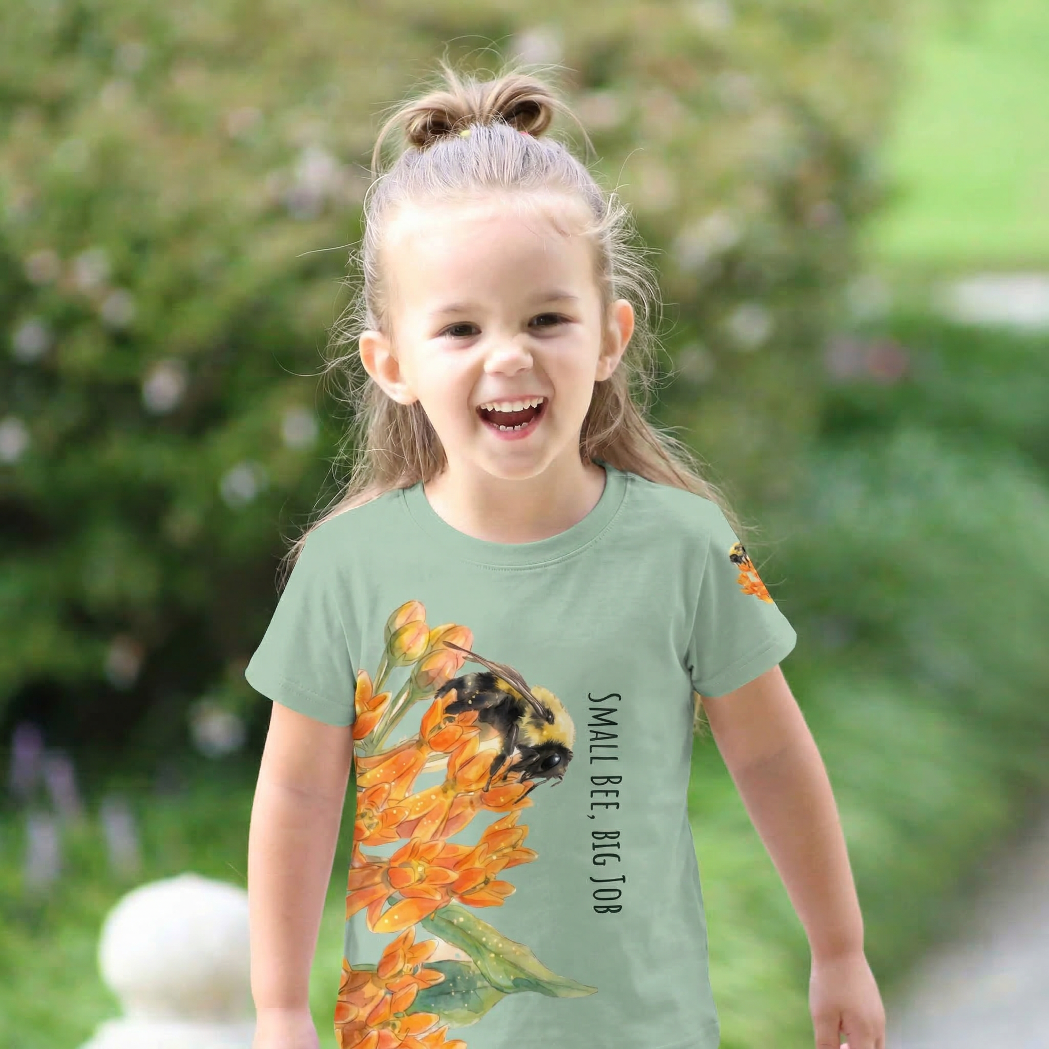 Child wearing Kids crew neck t-shirt featuring a fuzzy bumblebee and botanical flowers from The Golden Dust collection.