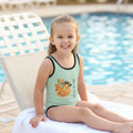 Toddler sitting at the pool wearing a Tinywing Tales: Golden Dust Bumblebee Kids Swimsuit