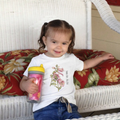 Child wearing White 100% cotton toddler t-shirt with 'Small Bee, Big Job' bee and foxglove illustration  on the front.