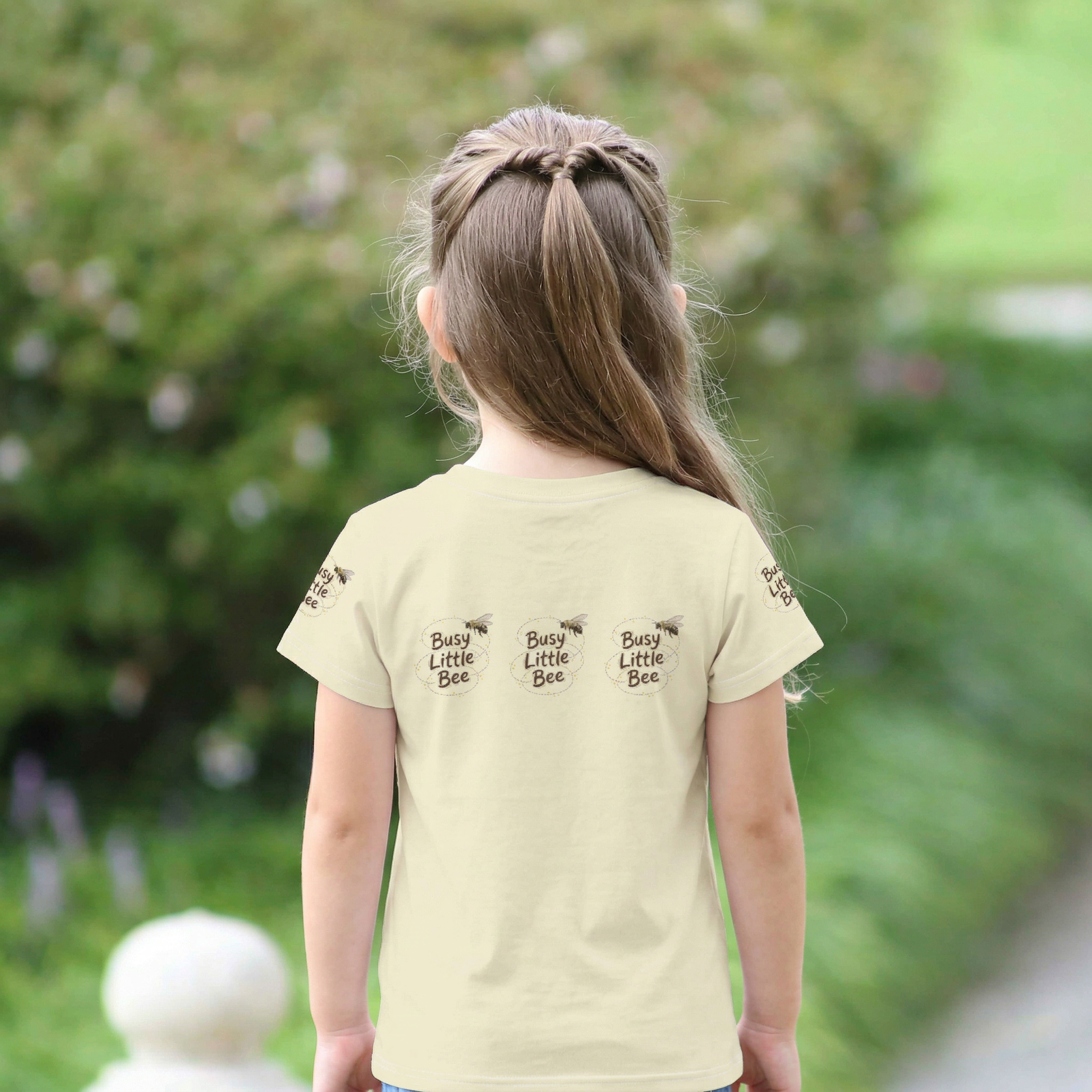 Back view of Toddler girl wearing a "Buzy Little Bee" graphic Tee with a Bee Graphics | Tinywings Tales