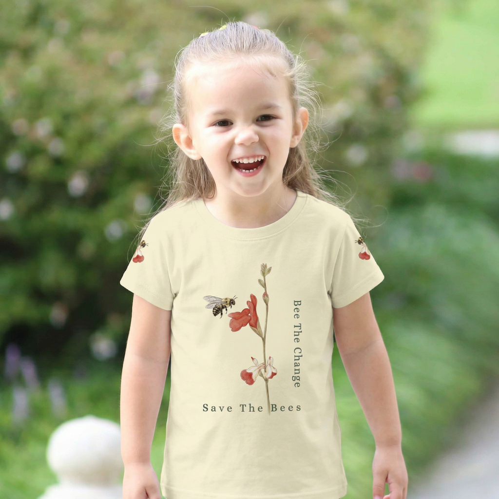 Child wearing a 'Bee The Change, Save The Bees' t-shirt outdoors. Tinywings Tales