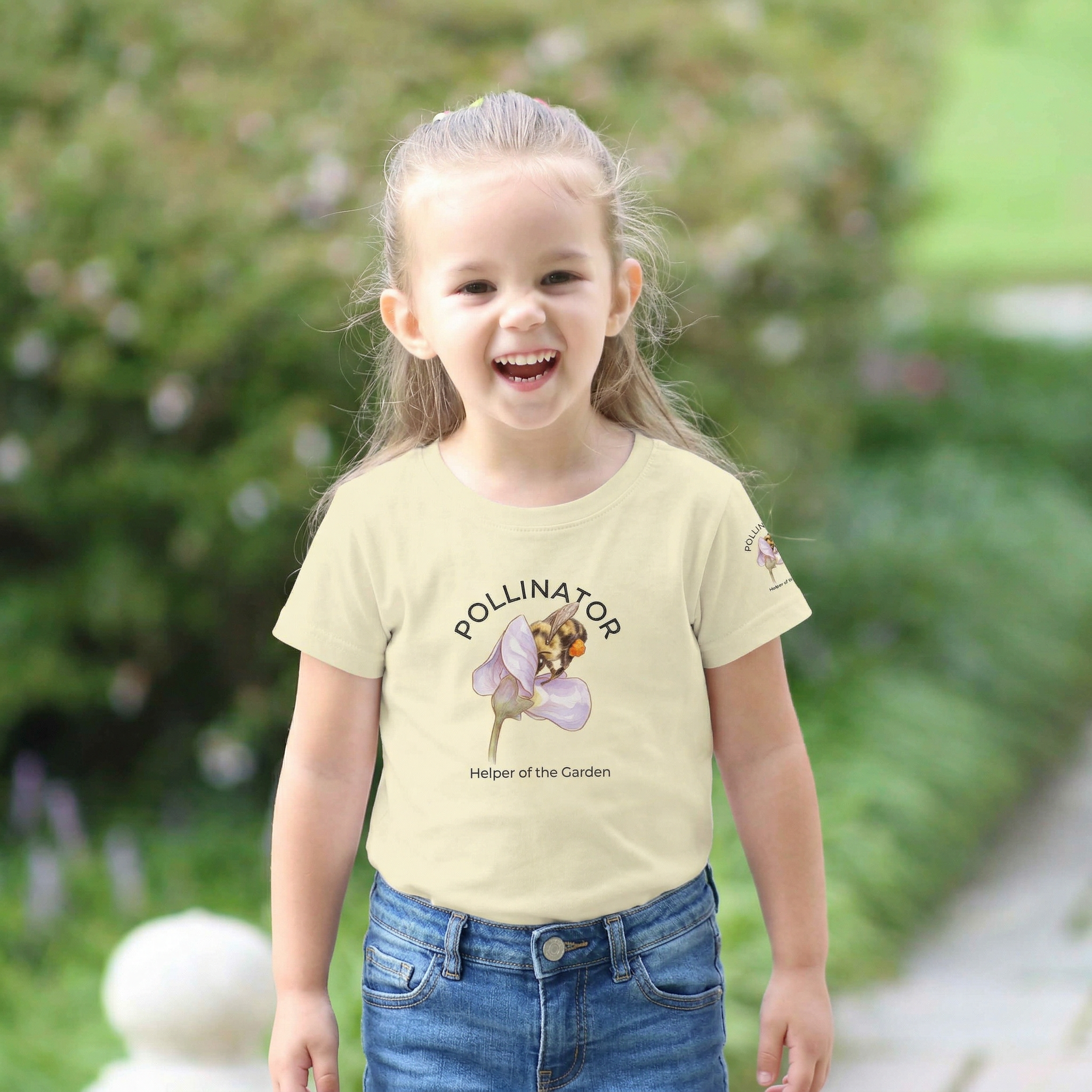 Child wearing a t-shirt with a graphic of a bee and text, standing outdoors. Tinywing Tales