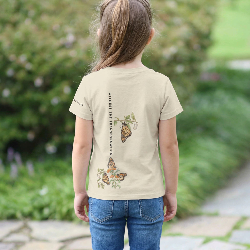 Back view of Toddler wearing a t-shirt with butterfly design outdoors. Tinywing Tales