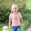Child wearing a pink t-shirt with butterfly design outdoors. Tinywing Tales