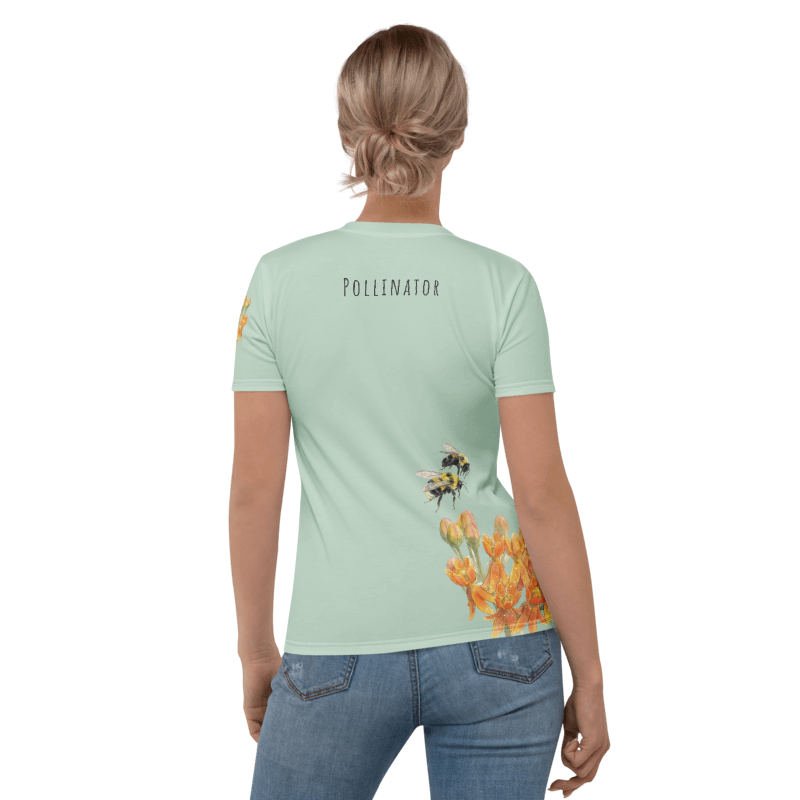 Rear view of aPerson wearing a light green t-shirt with a bee and flower design on the back.