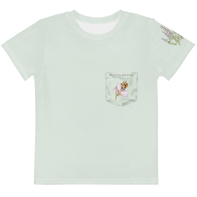 Light sage t-shirt with floral design on pocket and sleeve, brand 'Bloom Bound' visible. Tinywing Tales