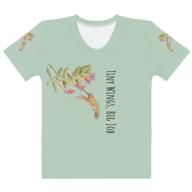 a light green t-shirt with a graphic design of a hummingbird and flowers and text "Tiny Wings, Big Job" 