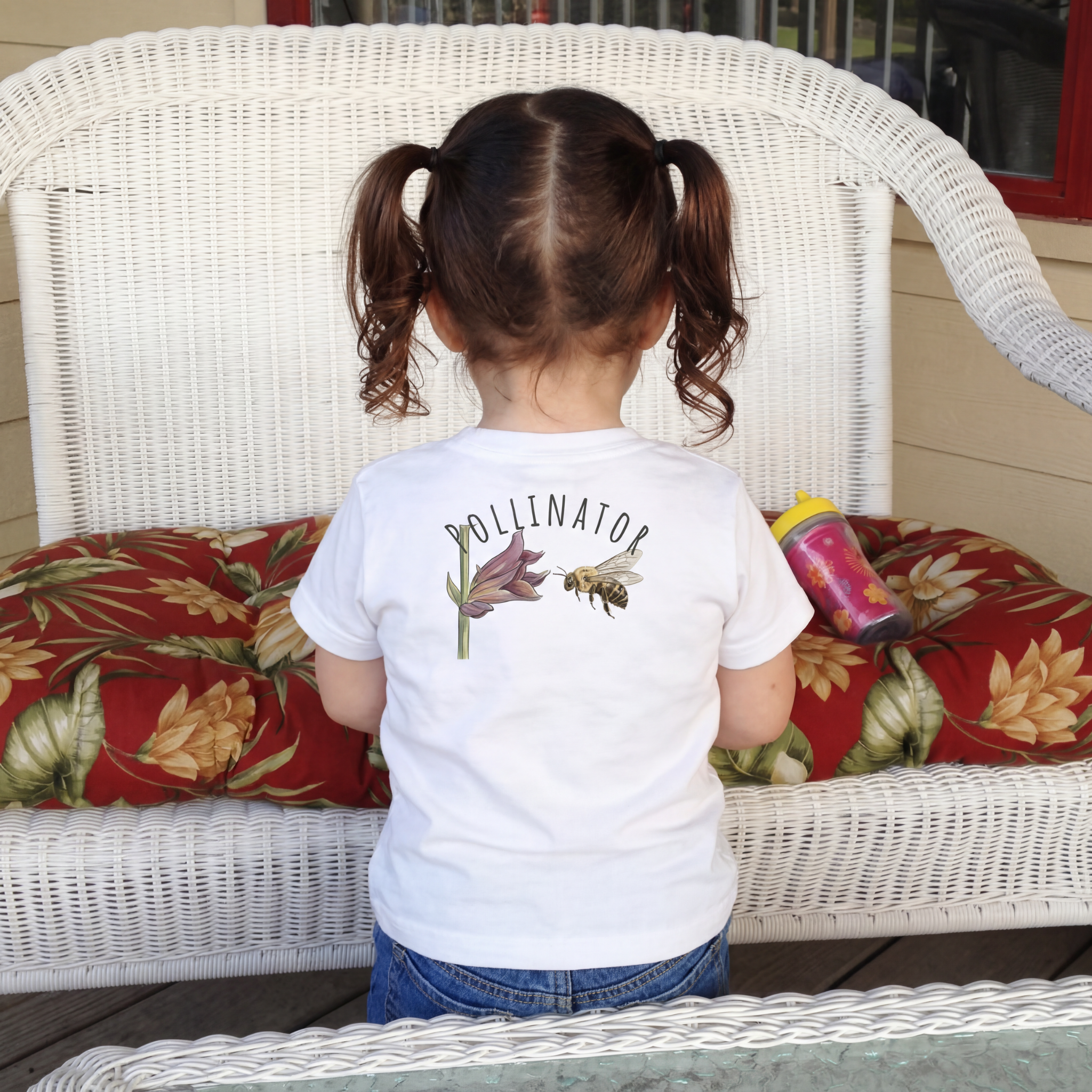 Back view of a toddler, wearing a Small Bee, Big Job classic cotton Tee