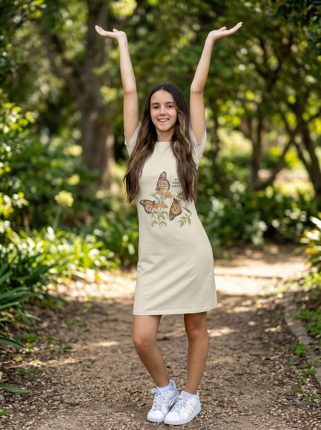 Young girl wearing tee shirt dress with butterfly graphic with text "plant, protect, preserve" Tinywing Tales.