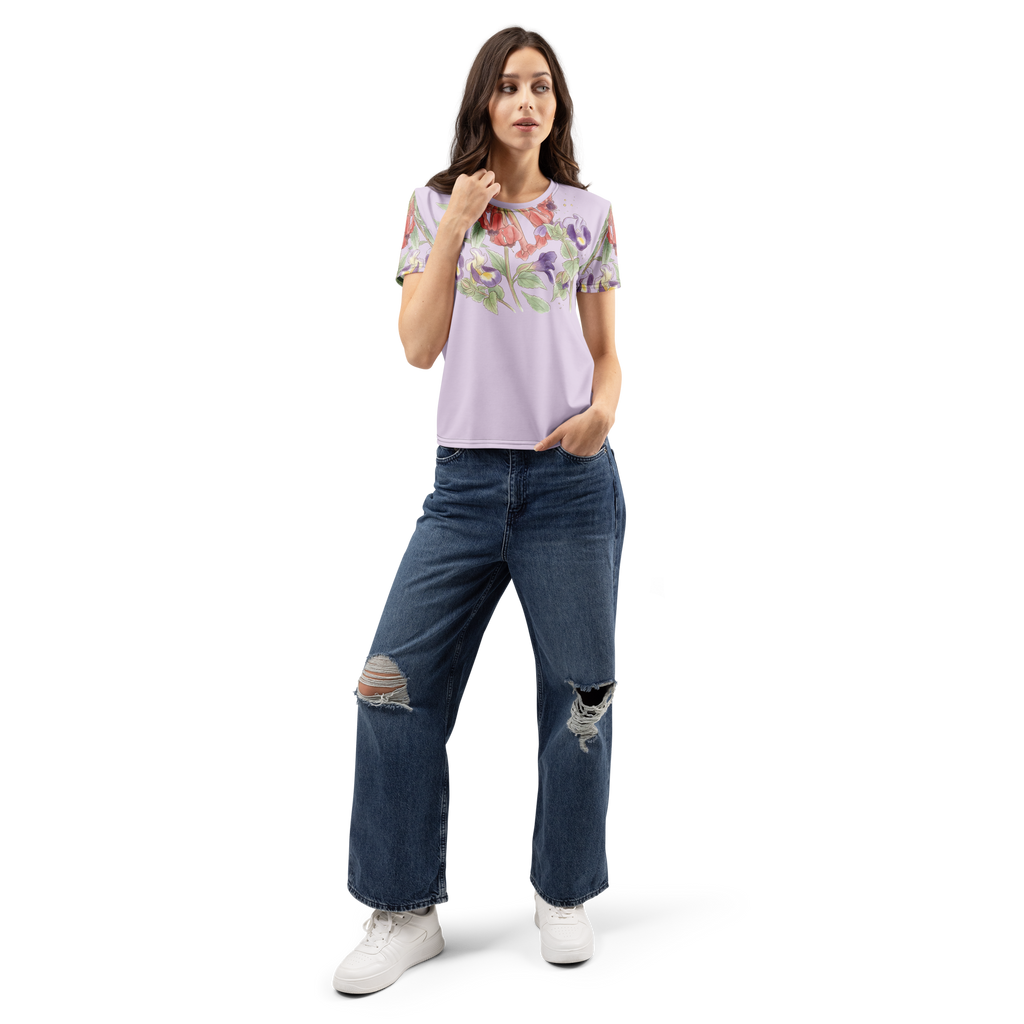 Woman wearing a floral t-shirt and ripped jeans 