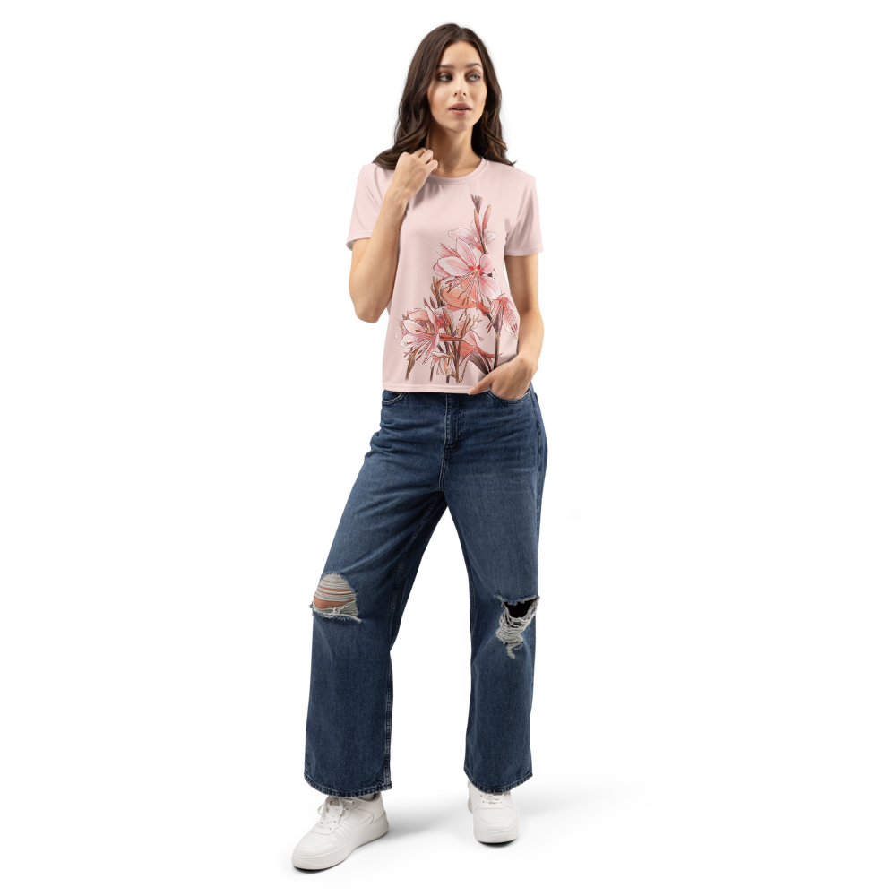 Woman wearing a floral t-shirt and ripped jeans 