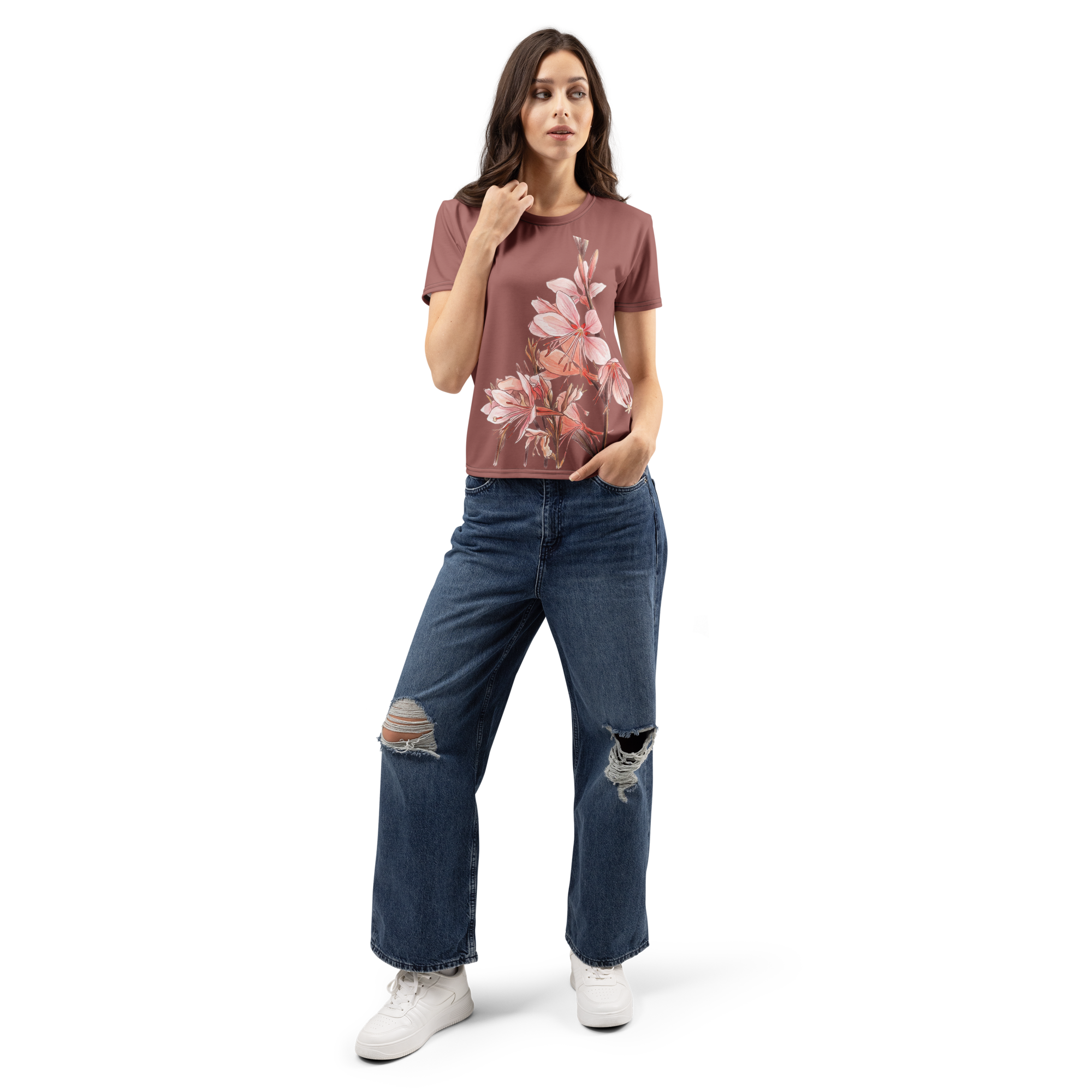 Woman wearing a floral t-shirt and distressed jeans 
