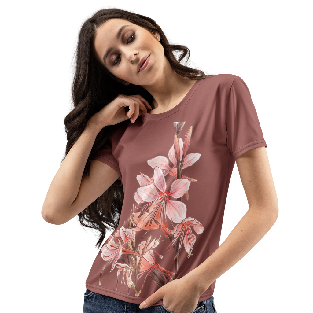 Woman wearing a mauve t-shirt with floral design 