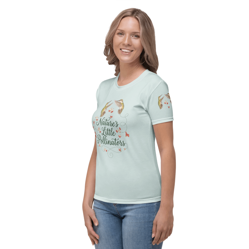 left sideview of Woman wearing a light blue t-shirt with a graphic of hummingbirds and text "Nature's Little Pollinators"