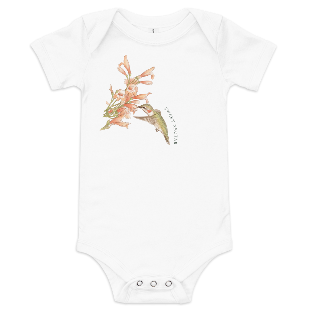 "Sweet Nectar" hummingbird baby one-piece in white, featuring a hand-painted style bird and floral illustration.