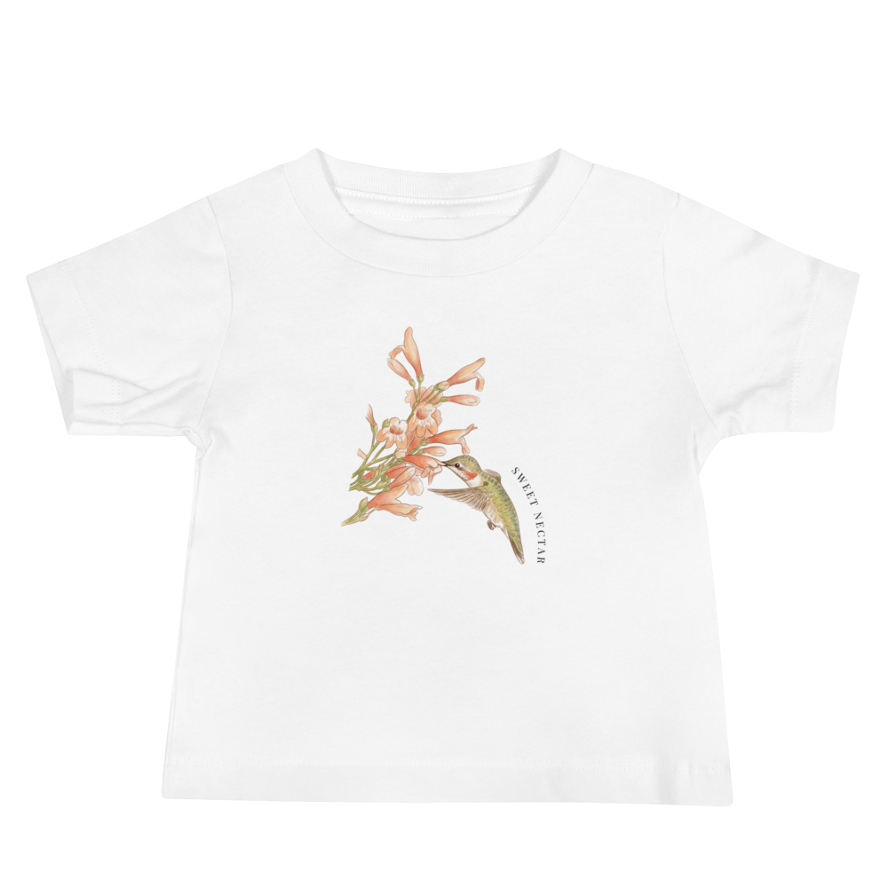 White t-shirt with a hummingbird and flower design on a white background