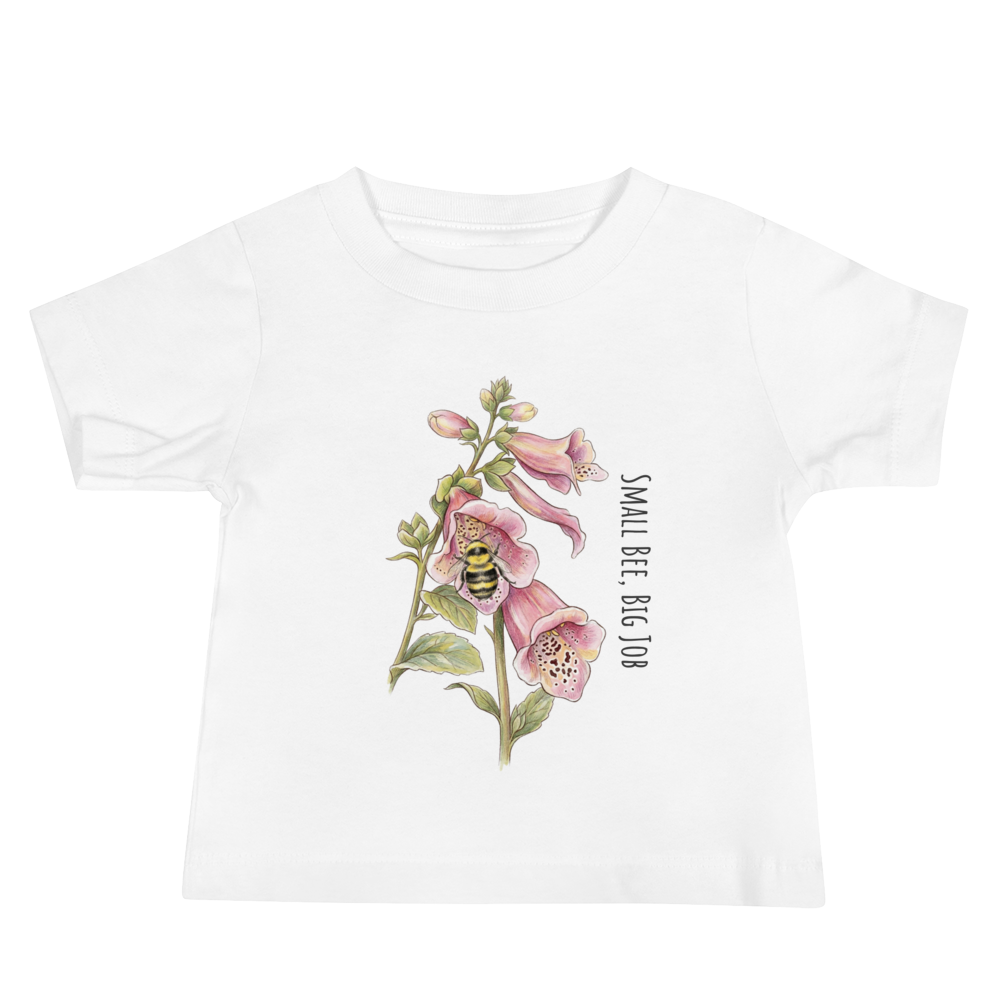 White t-shirt with floral design and bee illustration on a white background