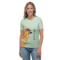 Woman wearing a light green t-shirt with a bee and flower design 