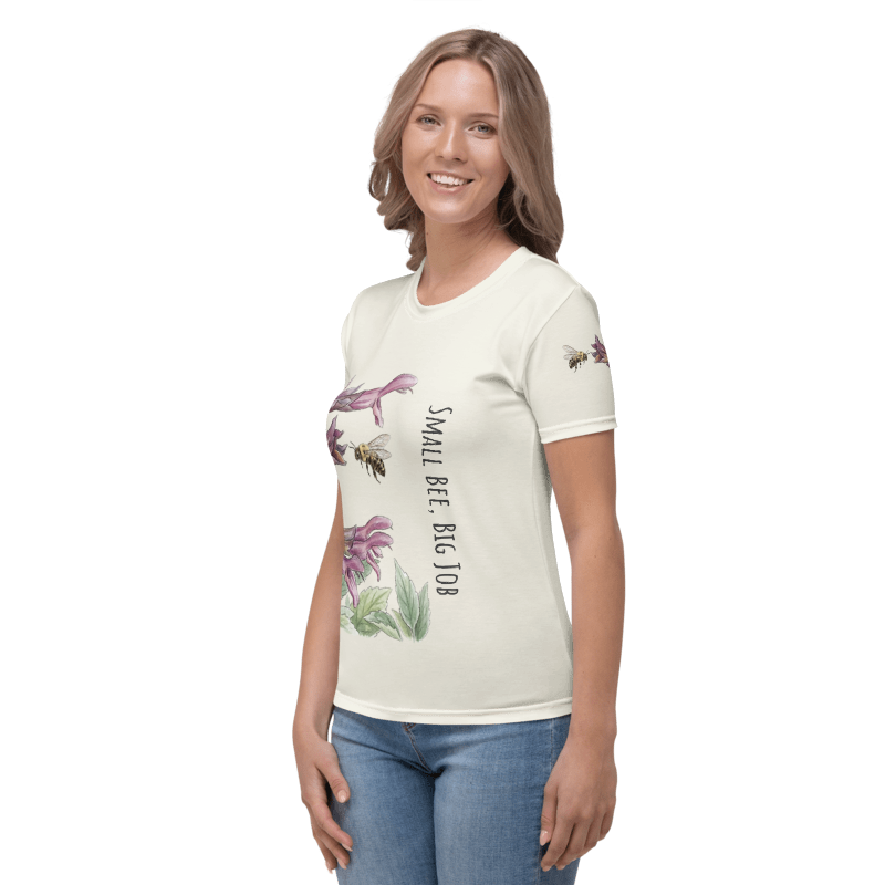 Left side view of a Woman wearing a  t-shirt with floral  and Bee design and text "Small Bee, Big Job"