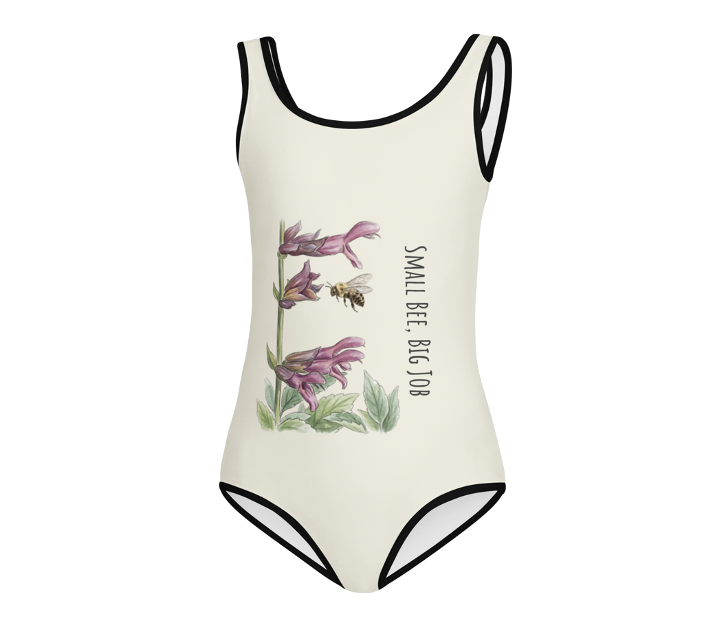 One-piece swimsuit with floral design and text on a cream background