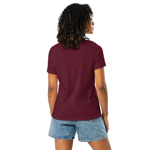 Person wearing a maroon t-shirt and denim shorts on a white background