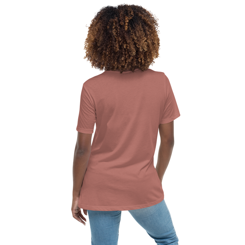 Person wearing a mauve t-shirt and blue jeans 
