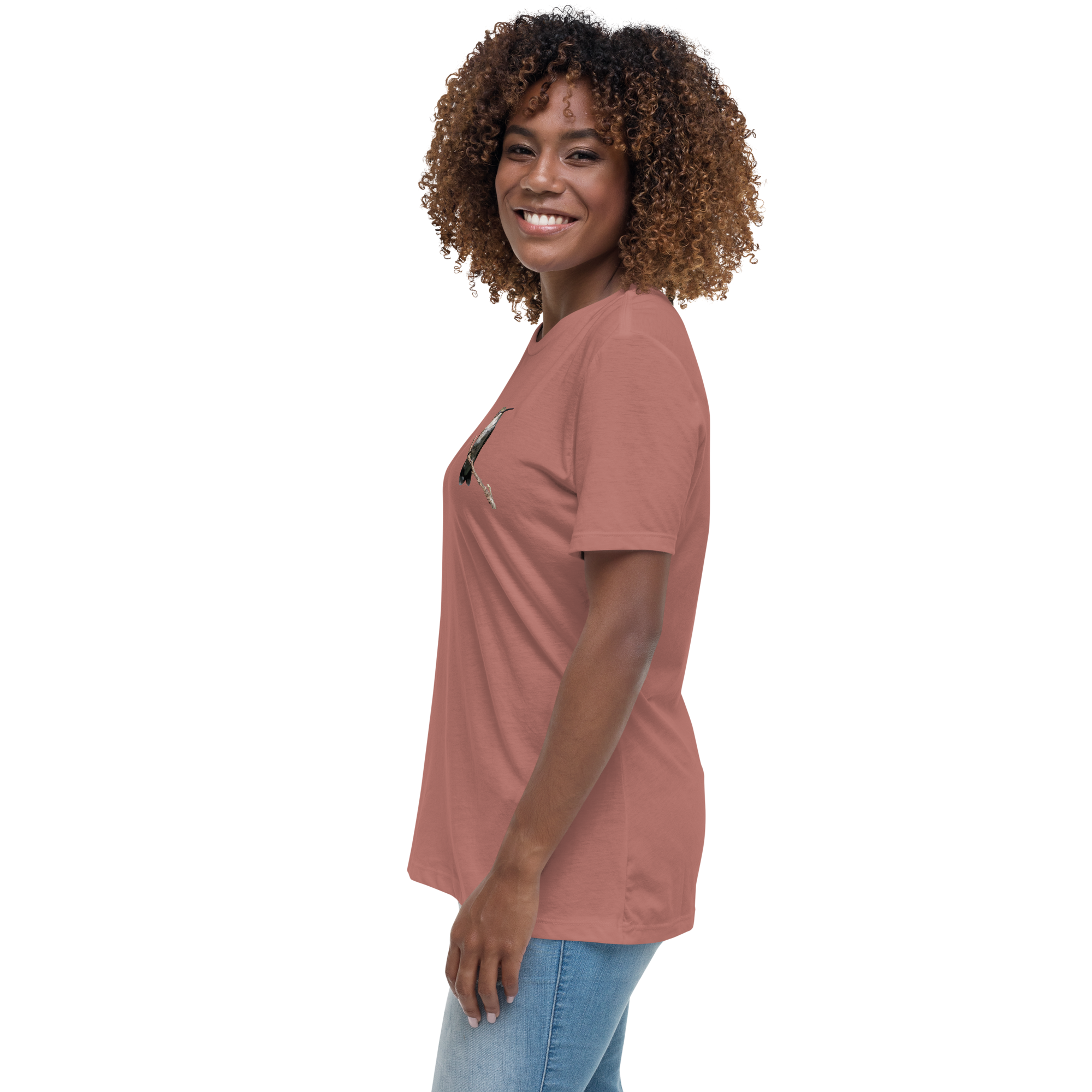 side view of Woman wearing a mauve t-shirt with a hummingbird photo on a branch