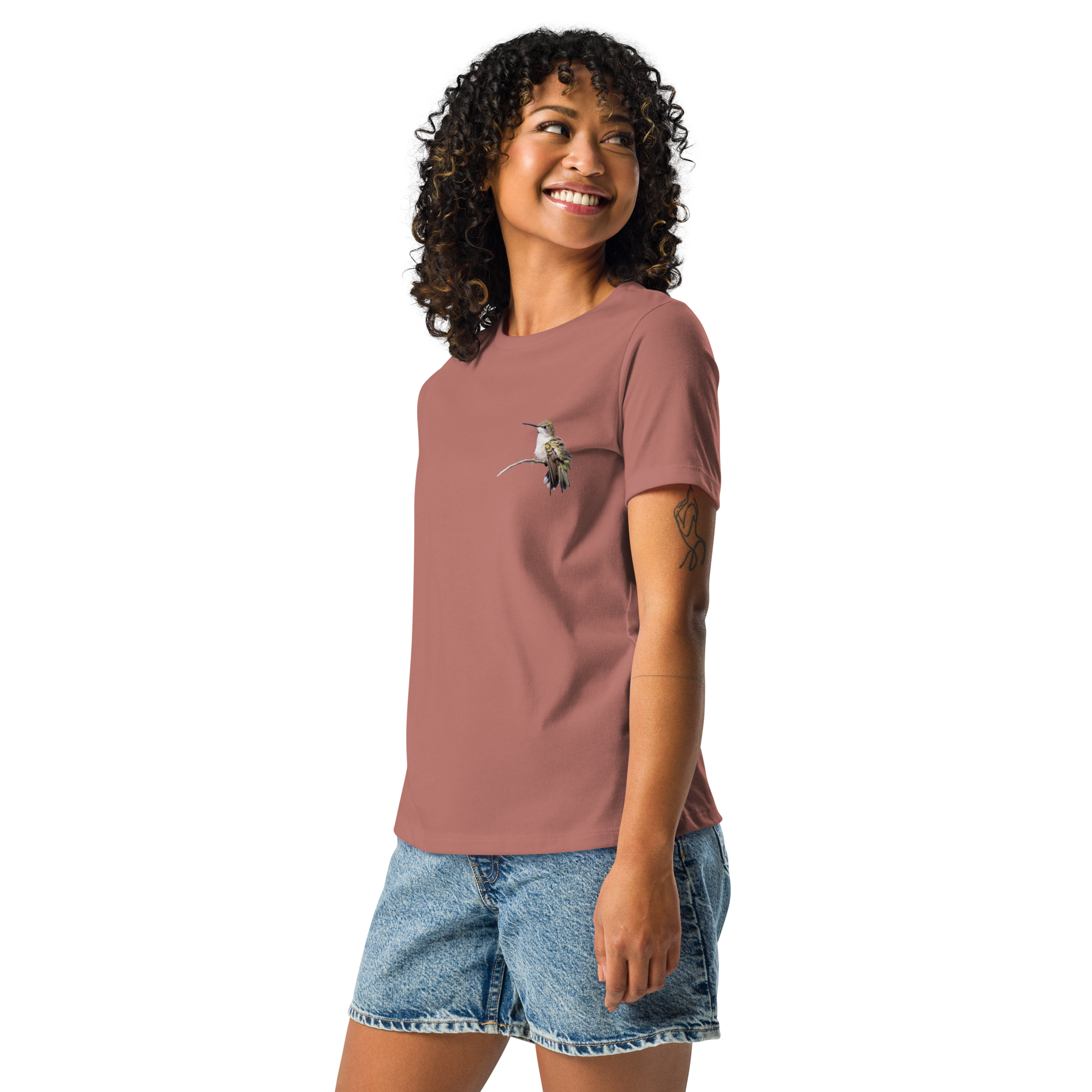 Left view Woman wearing mauve tee shirt with photo of a hummingbird on a branch