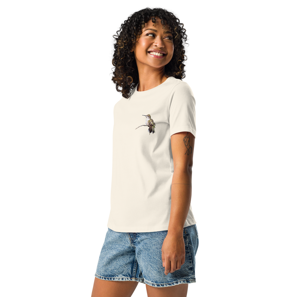 Left view of Woman wearing natural color tee shirt with photo of a hummingbird on a branch