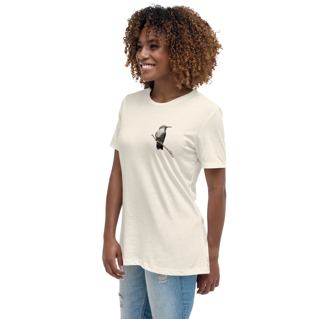 left view of Woman wearing a natural color t-shirt with a hummingbird photo on a branch