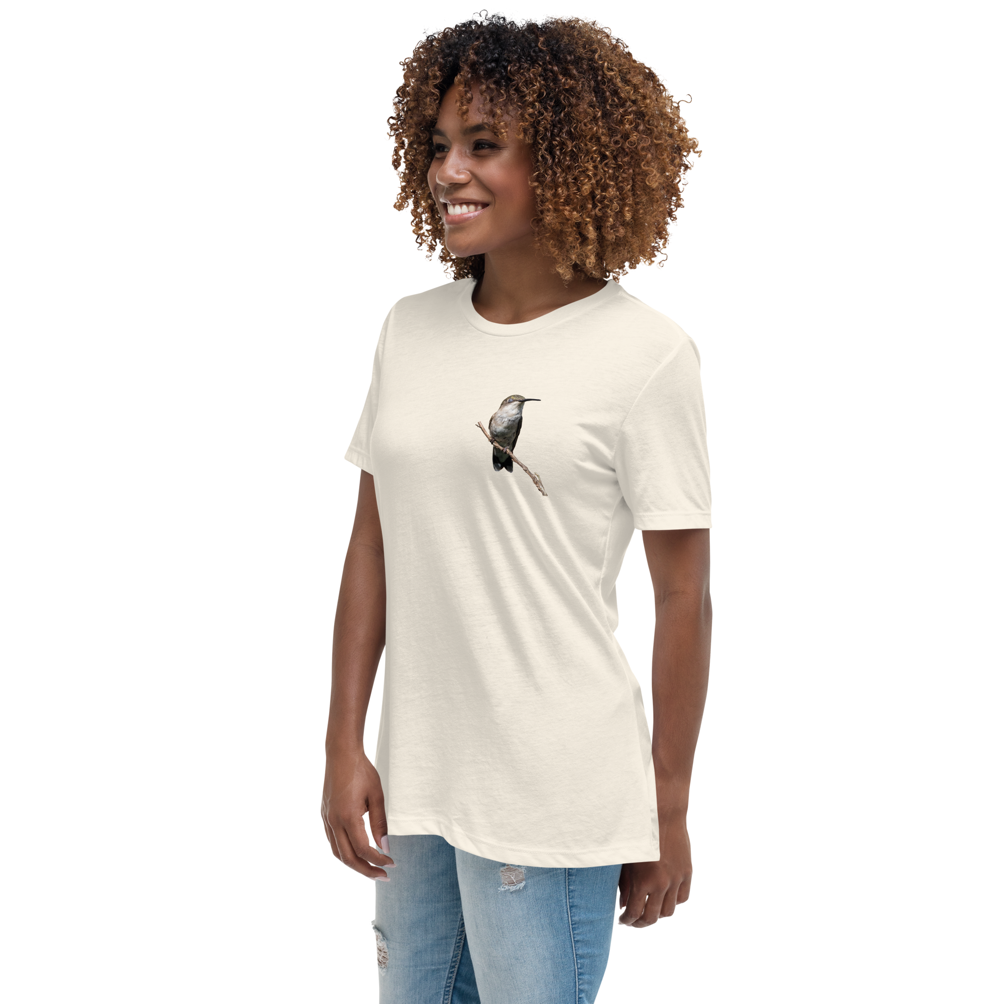 left view of Woman wearing a natural color t-shirt with a hummingbird photo on a branch