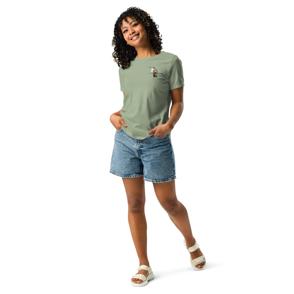 Woman wearing sage tee shirt with photo of a hummingbird and jean shorts