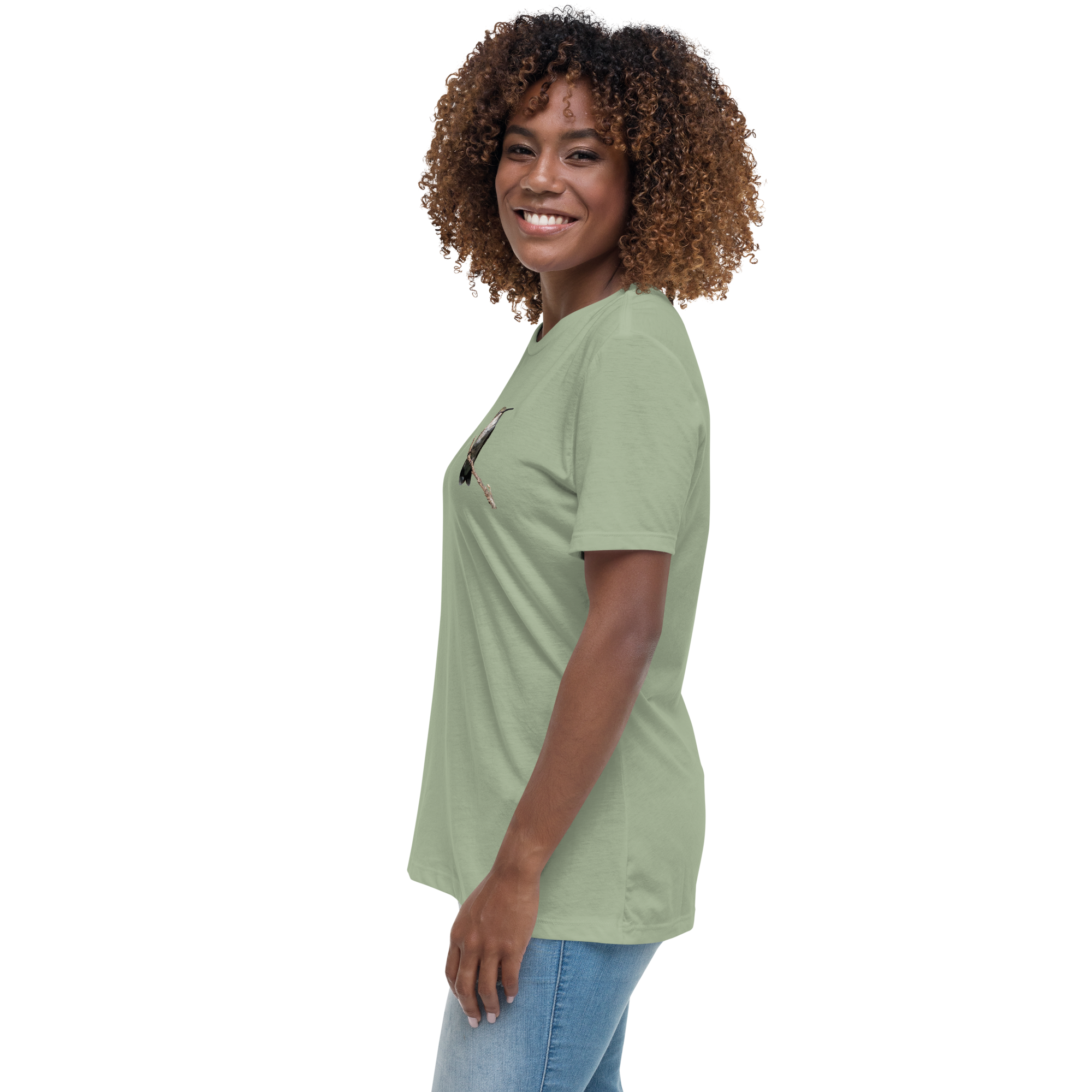 left view of Woman wearing a sage t-shirt with a hummingbird photo on a branch