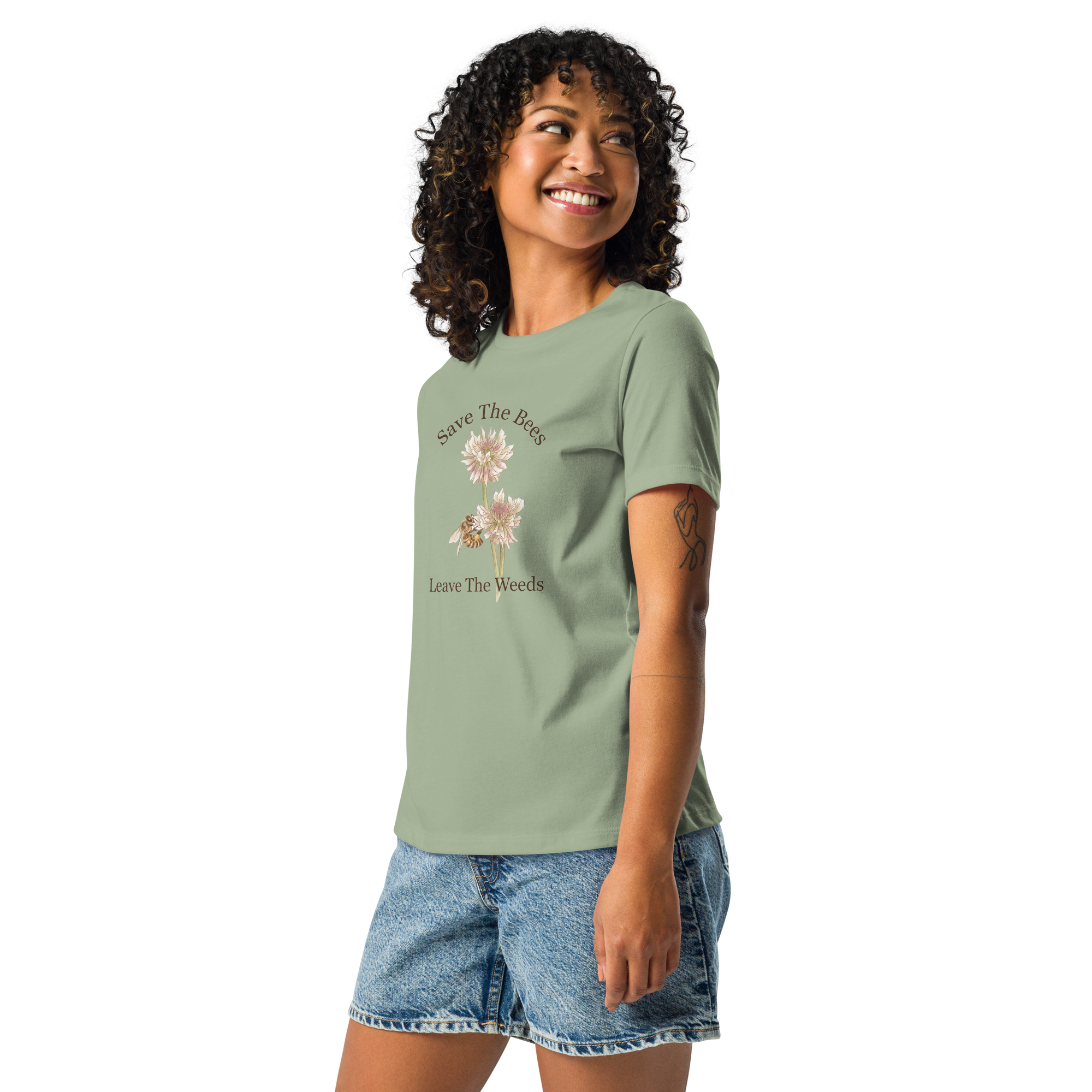 Woman wearing a sage t-shirt with a floral design with bee and text "Save the Bees"