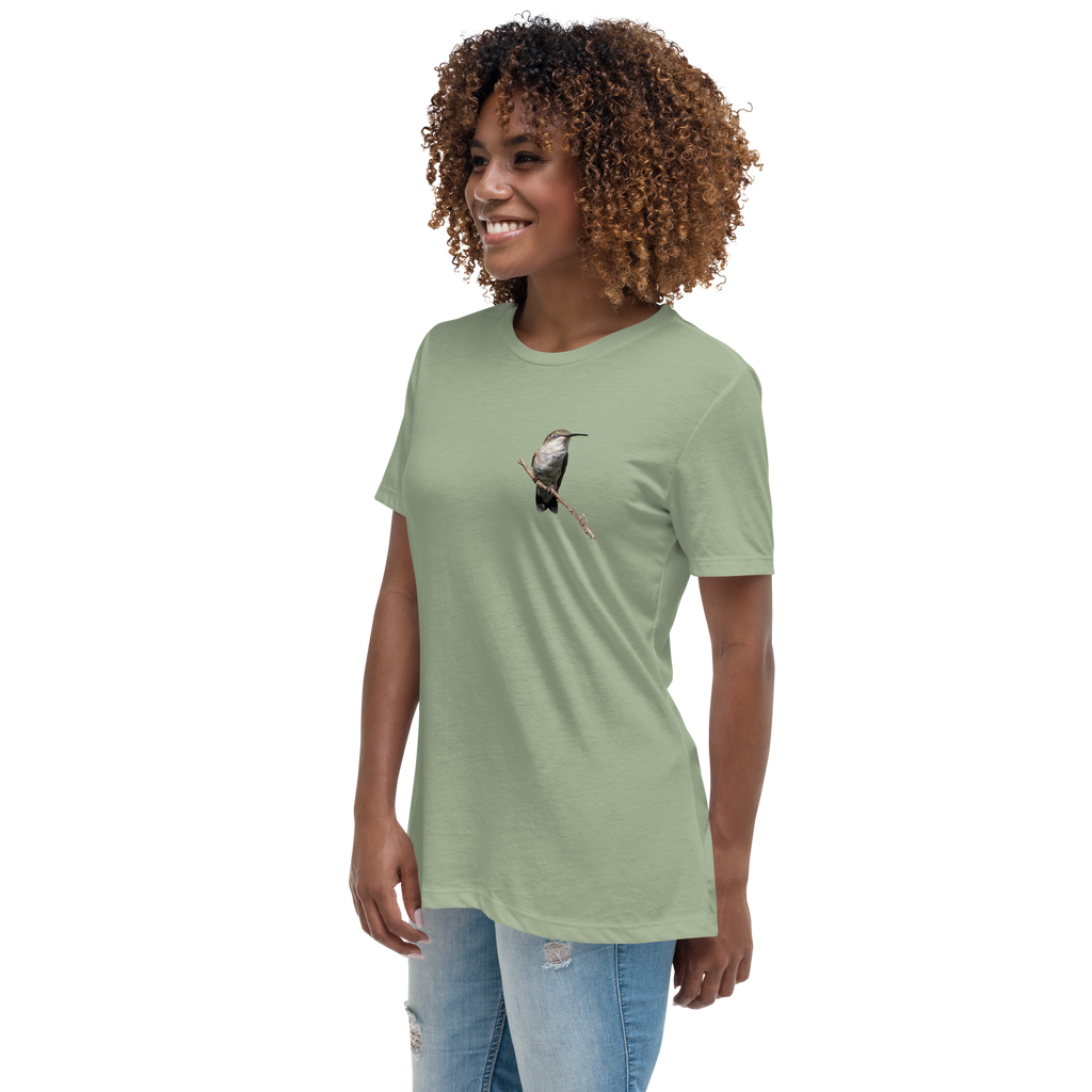 left view of Woman wearing a sage t-shirt with a hummingbird photo on a branch