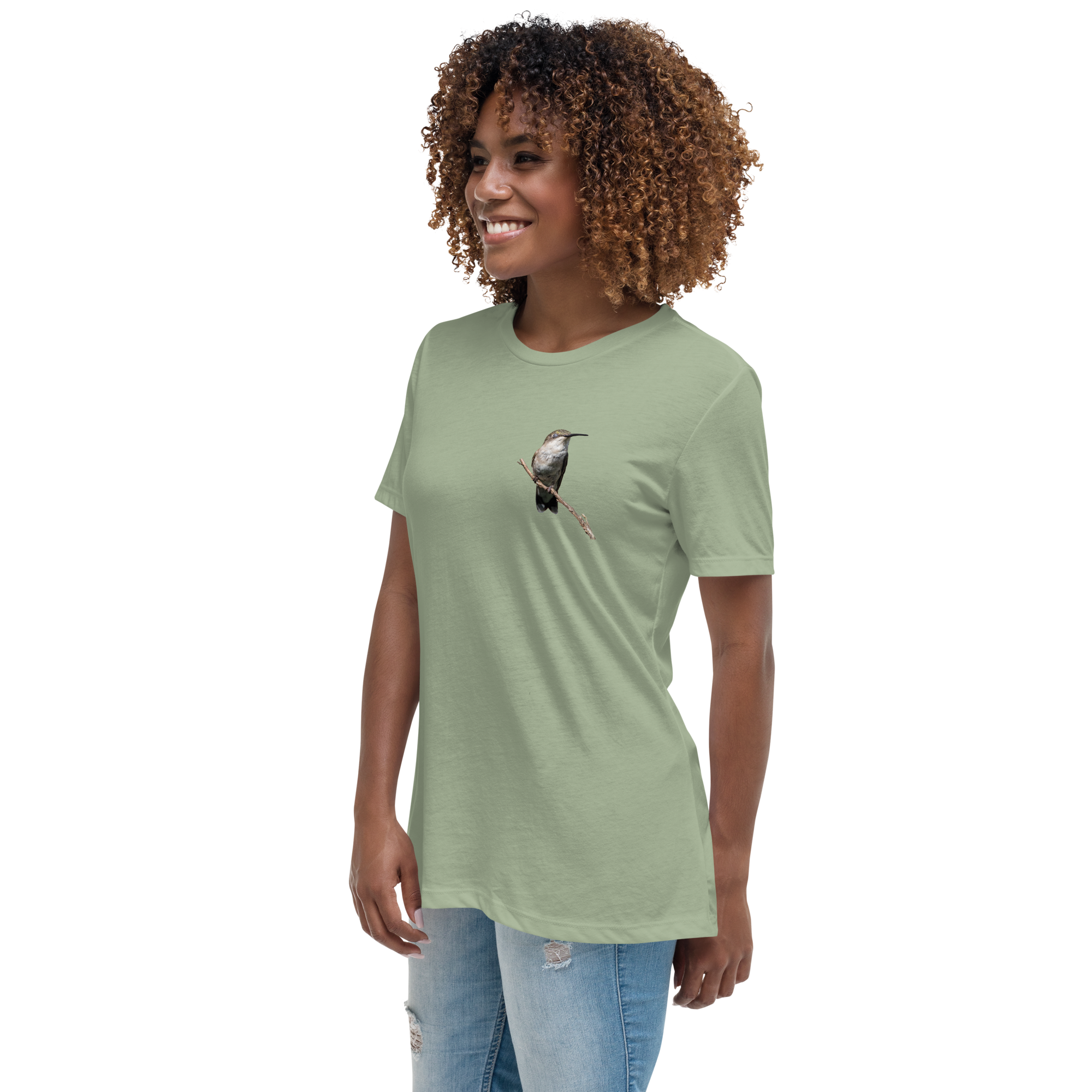 left view of Woman wearing a sage t-shirt with a hummingbird photo on a branch